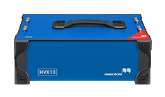 Front view of OMICRON HVX10 module with rugged casing, top handle, and safety-marked corner—engineered for high-voltage testing.